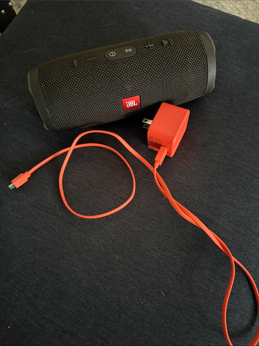 JBL Charge 3 speaker with charging cable and plug